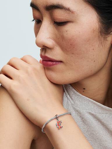 Honor of Kings spear sterling silver dangle with clear cubic zirconia, orange lab-created opal, orange and transparent red enamel